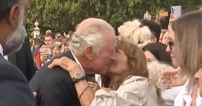 King Charles kissed on face by bold royal fan on first Buckingham Palace walkabout