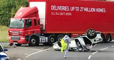 Car flips onto roof in horror crash with lorry near Edinburgh as woman charged