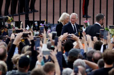 'God save the King!' Charles arrives in London