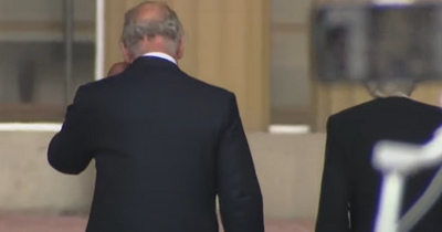 King Charles wipes tears from eyes as he walks into Buckingham Palace after Queen's death