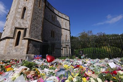‘The nation’s grandma gone’: Tears and tributes at Windsor Castle following Queen’s death