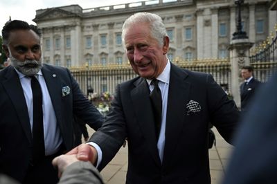 Crowds hail King Charles III as mourning begins for late queen