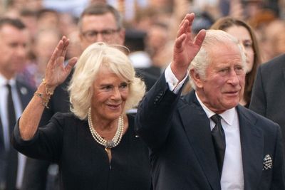 King Charles receives condolences and kisses from crowd at Buckingham Palace