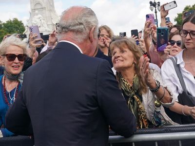 Woman who kissed King Charles said she will take the moment with her ‘forever’