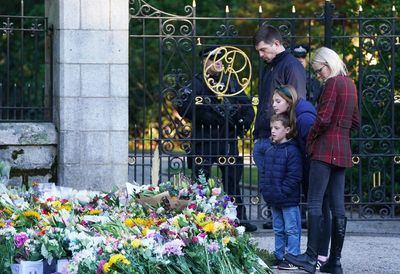 Crowds of mourners lay flowers at Balmoral for ‘warm and kind’ Queen