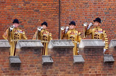 Trumpet fanfare amid precise pageantry for public proclamation of King’s reign