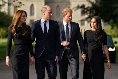 Harry and Meghan join William and Kate to inspect tributes to Queen at Windsor Castle