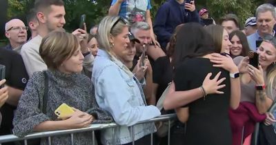 Moment Meghan Markle hugs teen in crowd of mourners outside Windsor