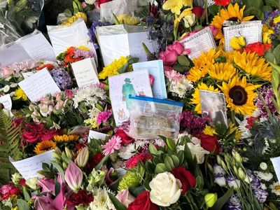 Scores of sunflowers left to honour the ‘joy and happiness’ Queen brought