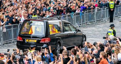 Mourners in tears as Queen's coffin passes through Edinburgh streets