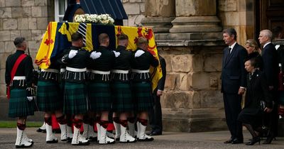 Queen's children watch as coffin arrives in Edinburgh after she begins final journey