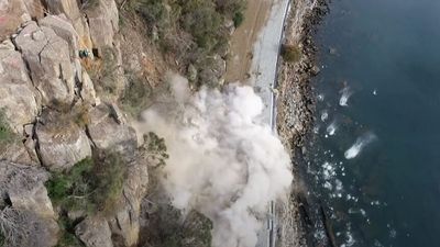 Rockfall briefly blocks Tasman Highway again as angry locals call for solution to ensure towns not cut off