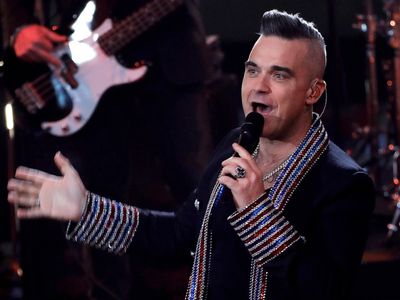 Robbie Williams reveals he threw up on stage during his show in Munich