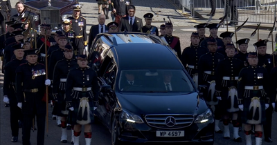 King Charles leads emotional procession from Royal Mile to St. Giles cathedral for Queen's coffin
