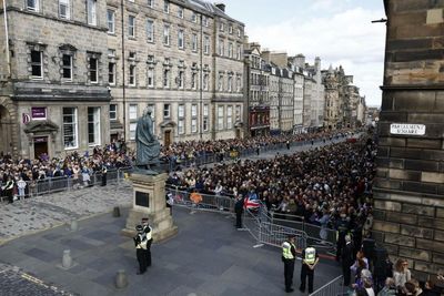 Silence as Queen's coffin procession travels up Royal Mile