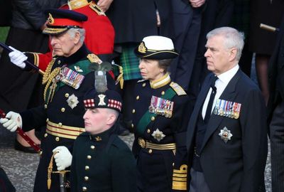 Prince Andrew follows Queen's coffin despite losing titles