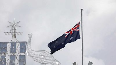 What flags fly at half-mast after Queen Elizabeth II's death and for how long?