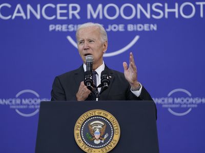 Biden touts his 'cancer moonshot' on the anniversary of JFK's 'man on the moon' speech