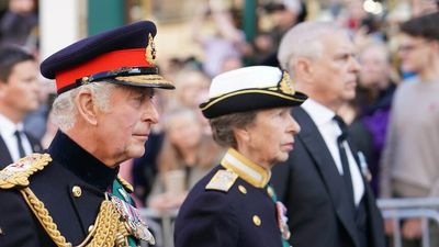 Queen Elizabeth makes her final journey through Edinburgh as King Charles walks behind
