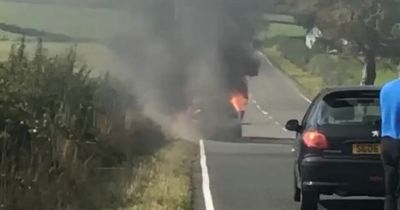 Car bursts into flames on major Ayrshire road as mercy crews race to inferno