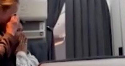 Emotional flight attendant breaks down as Queen's death is announced mid-flight