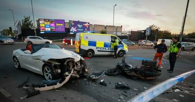 Horror crash between convertible and blood bike closes city centre road