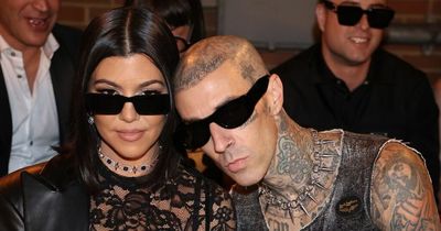 Travis Barker sprays champagne to celebrate Kourtney Kardashian's Boohoo collaboration