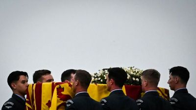 Crowds gather as UK queen's coffin to go on display in London