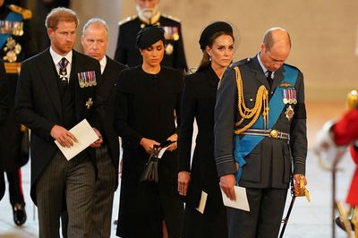 King Charles and sons escort queen's coffin as people line up to pay respects