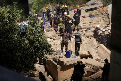 At least 10 still trapped in Jordan building collapse