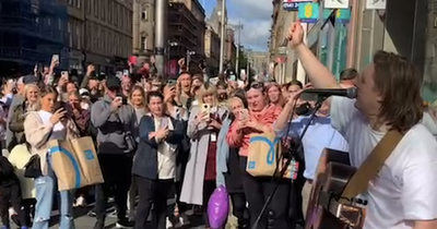 Lewis Capaldi busks on Buchanan Street and surprises passing Glaswegians