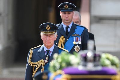 King Charles leads procession of queen’s coffin through London