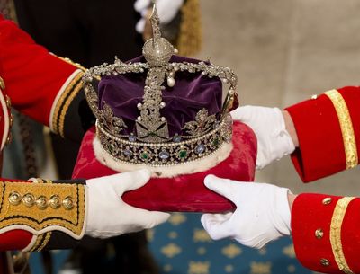 Imperial state crown and Balmoral and Windsor flowers placed on Queen’s coffin