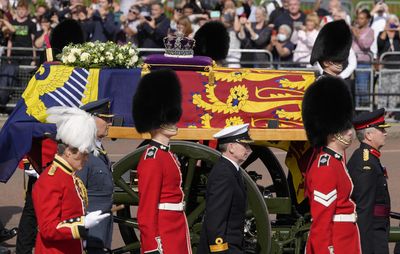 Queen Elizabeth II lies in state after a solemn procession from Buckingham Palace