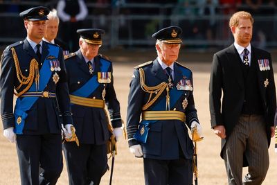 Prince Harry wears medals pinned to suit after being banned from wearing uniform at Queen’s procession