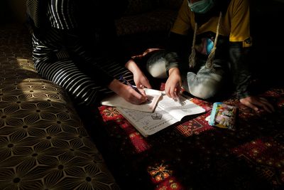 Afghans keep close watch as some girls' schools open, then shut