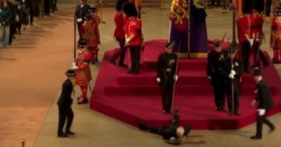Queen's guard suddenly collapses and falls on his face while on coffin podium