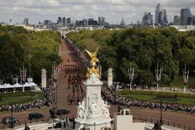 Queue stretches for miles as people wait to pay late Queen their respects