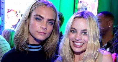 Margot Robbie looks emotional and distressed as she leaves Cara Delevingne's house