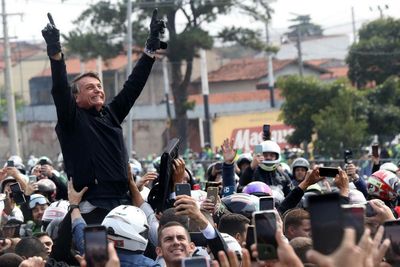 ‘Bolsonaro promotes hatred’: violence stalks run-up to crucial Brazil election