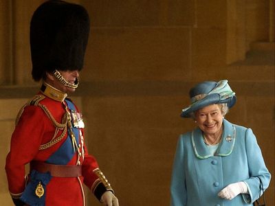 The real story behind the giggling photograph of Prince Philip and the Queen