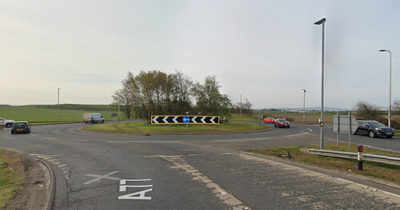 Emergency services race to A77 roundabout after crash between car and motorbike