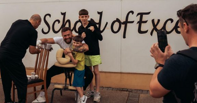 Conor McGregor poses for photos with kids in Crumlin