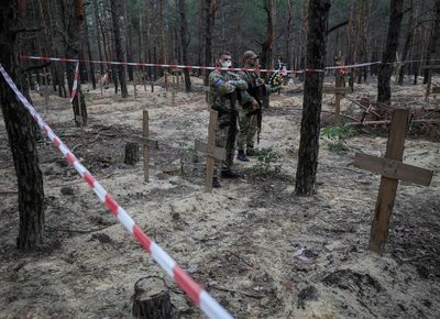 Ukraine says some bodies found in mass burial site had been bound