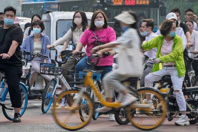 China's consumer, factory activity improve but still weak