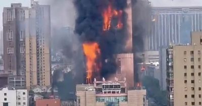 China fire: Enormous blaze rips through city skyscraper as smoke billows into the air