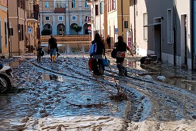 Floods in Italy kill at least 10; rescues from roofs, trees