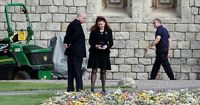 Prince Andrew spotted with Sarah Ferguson inspecting floral tributes to Queen as King Charles visits Wales