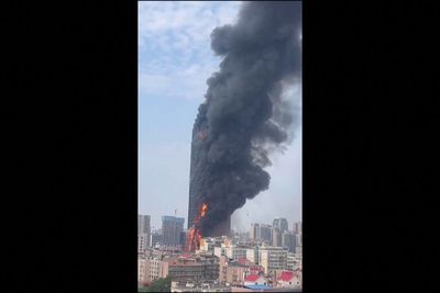 Fire engulfs 42-story building in China; no deaths reported