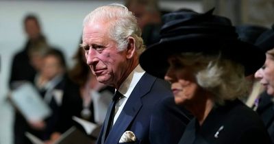 King Charles appears to bring his own pen to sign visitors' book in Cardiff after ink mishaps